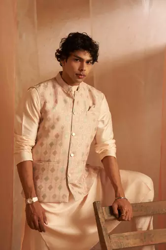 Peach ethnic indian wedding wear kurta payjama with nehru jacket for classy looks