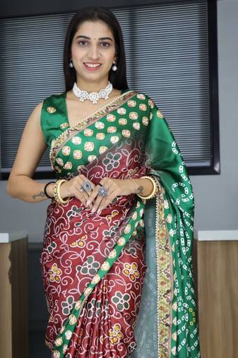 Maroon patola print satin saree with unstished blouse