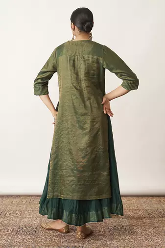 The bottle green silk tissue chanderi kalidaar ensemble