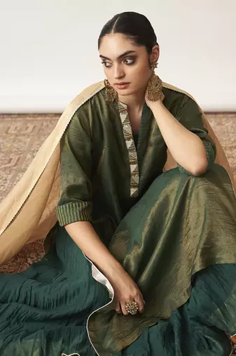 The bottle green silk tissue chanderi kalidaar ensemble