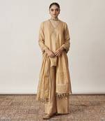 The gold silk tissue chanderi gharara set with pittha handwork