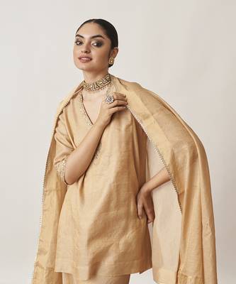 The gold silk tissue chanderi gharara set with pittha handwork 2