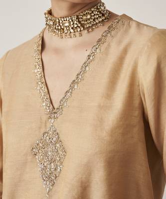The gold silk tissue chanderi gharara set with pittha handwork 3