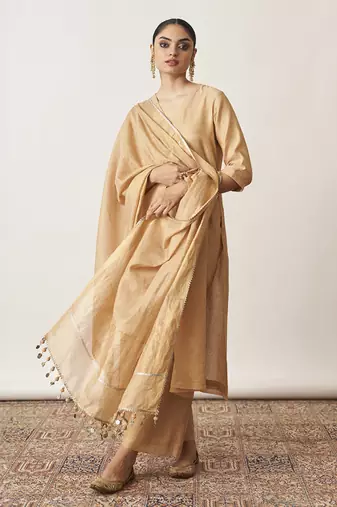 The gold beige silk tissue chanderi kurta & pants set