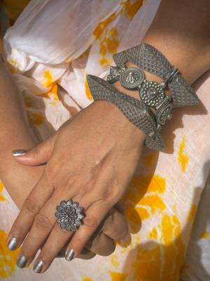 Silver lookalike bangle stack with floral design 1
