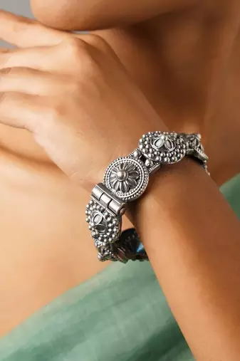 Silver lookalike bangle stack with floral design