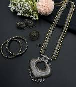 Dual tone long necklace with heart-shaped ghungroo pendant, matching ring, jhumka, bangles & silver nose pin