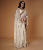 Cream tissue saree with luxe golden beads & sequins