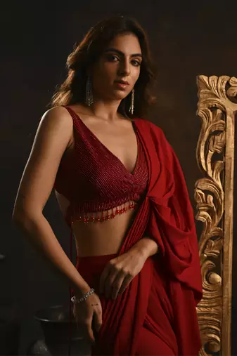 Red pre-drape saree with embellished blouse