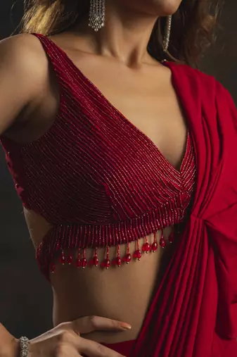 Red pre-drape saree with embellished blouse