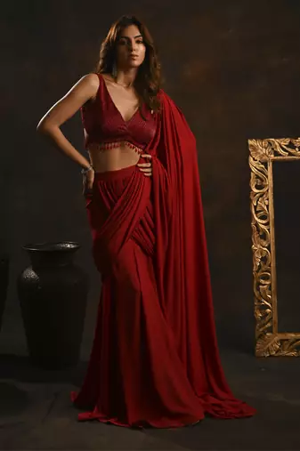 Red pre-drape saree with embellished blouse
