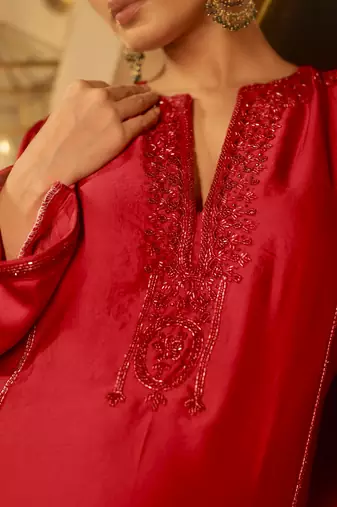 Red embellished kurta with flared pants