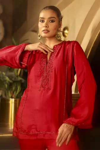 Red embellished kurta with flared pants