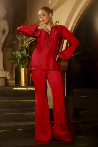 Red embellished kurta with flared pants