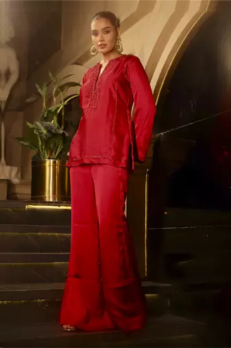 Red embellished kurta with flared pants