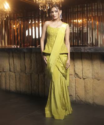 Parrot green pre draped saree with corset blouse in chantley net. 1