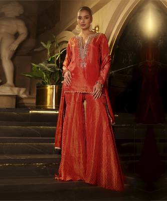 Orange bandhani tissue kurta with sharara and dupatta 1