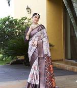 Off white trendy crepe saree with woven zari patta and designer print work