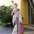 Off white trendy crepe saree with woven zari patta and print work