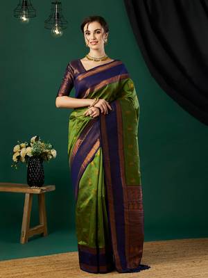 Green faux banarasi silk blend wevon zari heavy looks glamorous ceremonial saree 1