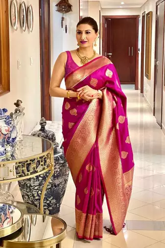 Magenta woven zari saree with gold blouse