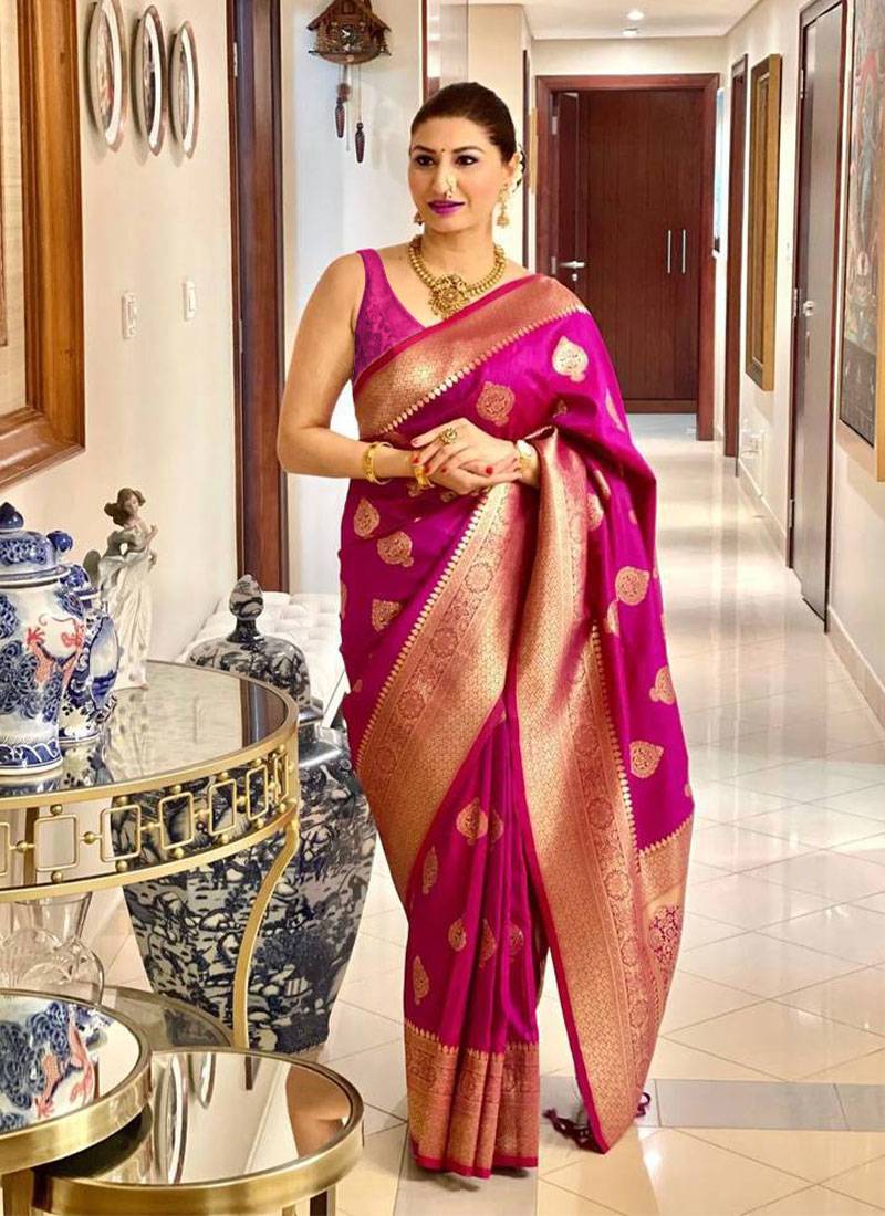 Magenta woven zari saree with gold blouse