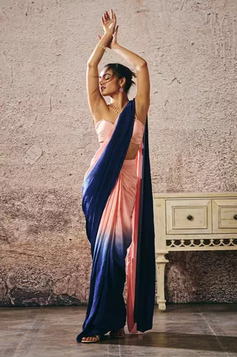 Peach blouse with peach and navy blue ombre saree