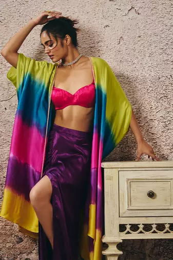 Hot pink blouse and purple skirt with ombre shrug