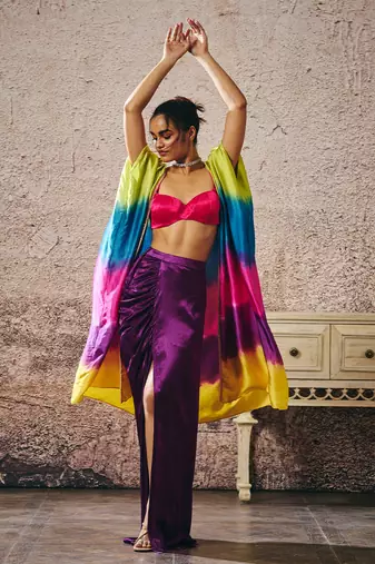 Hot pink blouse and purple skirt with ombre shrug