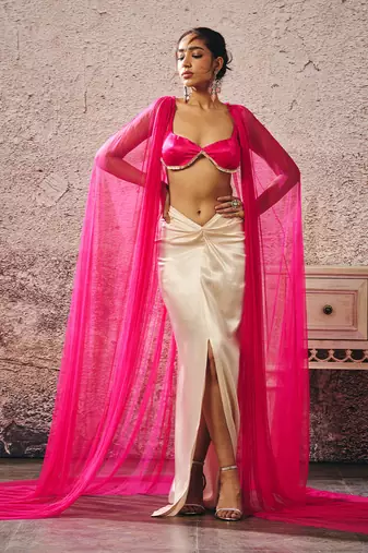 Beige skirt hot pink blouse with hot pink cape