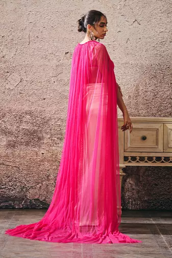 Beige skirt hot pink blouse with hot pink cape