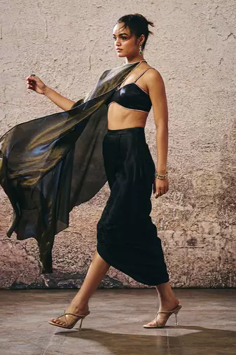 Black blouse with drape skirt with tissue cape