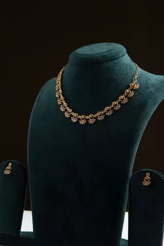 American diamond necklace set with intricate motifs