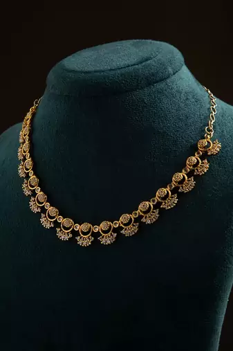 American diamond necklace set with intricate motifs