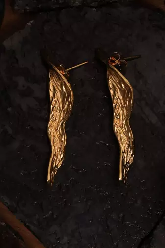 Artistic gold statement earring