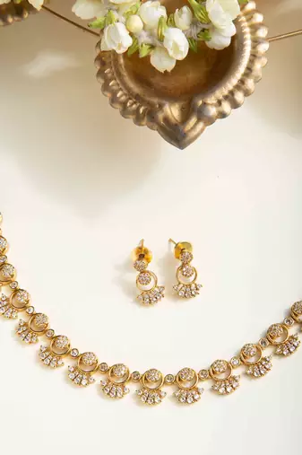 American diamond necklace set with intricate motifs