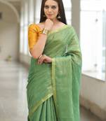 Handmade bhagalpuri tissue linen saree with mirror work in green shade with blouse piece