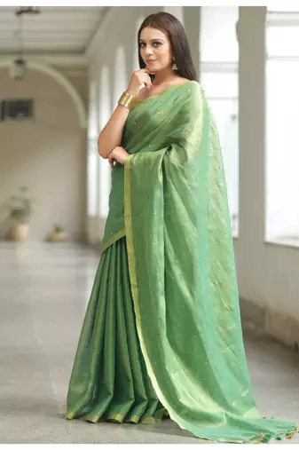 Handmade bhagalpuri tissue linen saree with mirror work in green shade with blouse piece