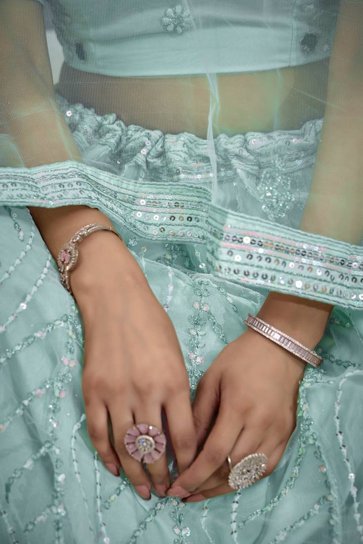 TURQUOISE THREAD SEQUINS EMBROIDERED NET SEMI STITCHED LEHENGA CHOLI