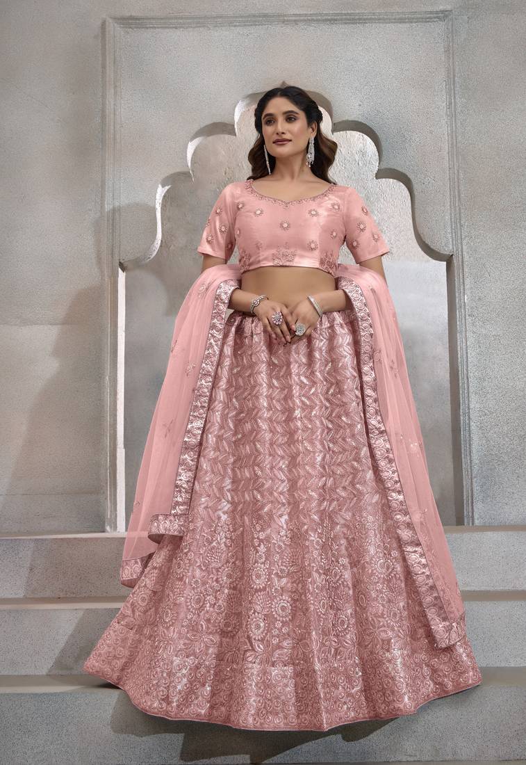 PEACH THREAD SEQUINS EMBROIDERED NET SEMI STITCHED LEHENGA CHOLI