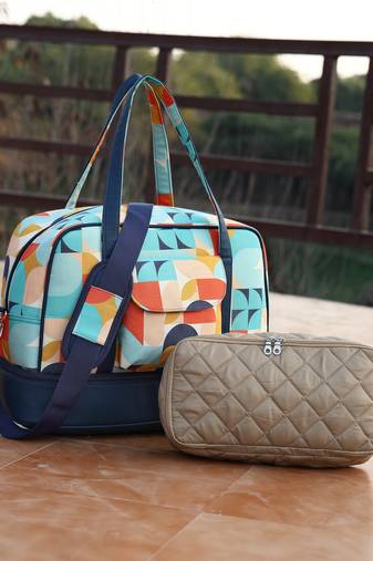 peppy navy & multi polycotton canvas & pu abstract printed duffel travel bag