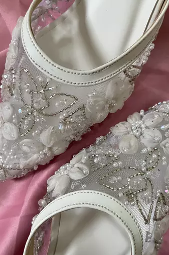 White hand embroidery net and embroidery heels