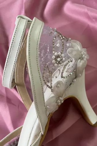 White hand embroidery net and embroidery heels
