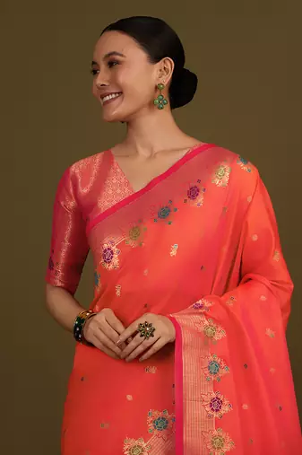 Dark peach banarasi silk blend saree with zari woven work