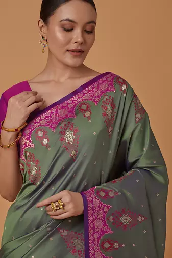Olive banarasi silk blend saree with zari woven work