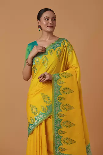 Yellow banarasi silk blend saree with zari woven work
