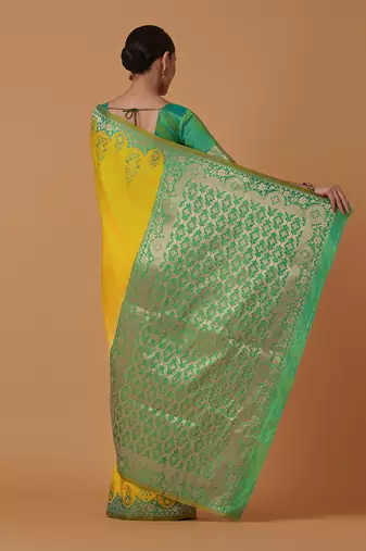 Yellow banarasi silk blend saree with zari woven work