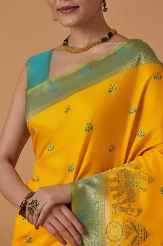 Yellow banarasi silk blend saree with dulha dulhan zari woven detailing