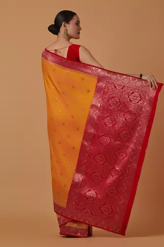 Amber banarasi silk blend saree with dulha dulhan zari woven detailing
