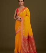 Yellow banarasi silk blend saree in classic paisley zari pallu & unstitched blouse